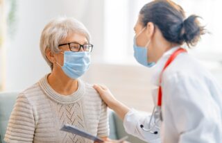 Doctor Helping Older Patient